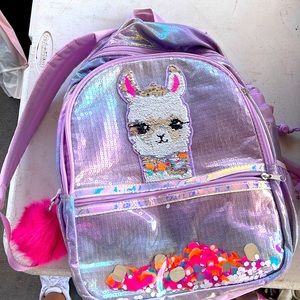 Selling a purple llama backpack from justice